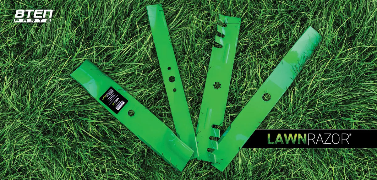 Four LawnRazor blades on plush green grass